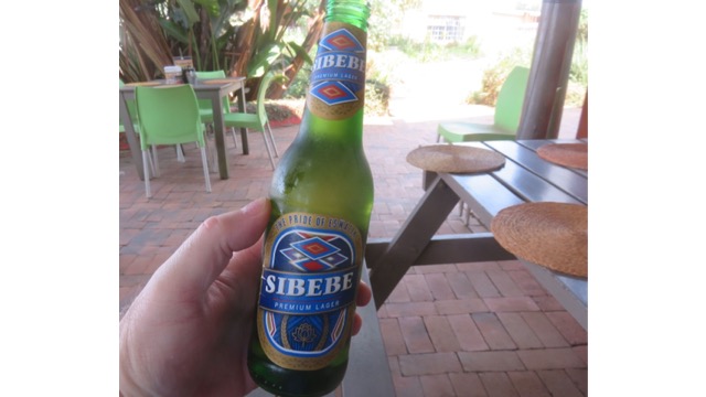 Refreshing with a cold Sibebe Beer at Swazi Candles